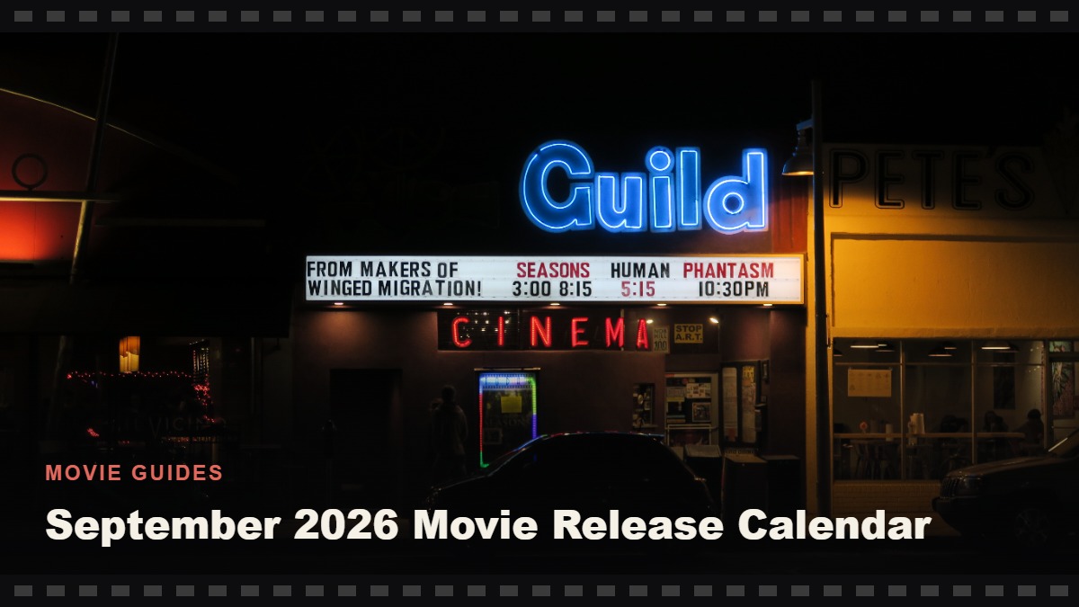 A neon-lit cinema marquee at night, illustrating the September 2026 movie release calendar